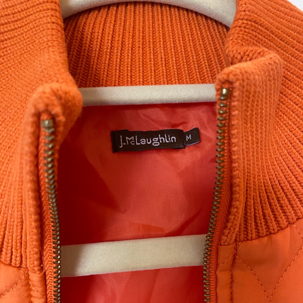 Orange quilted and knit zip up cardigan